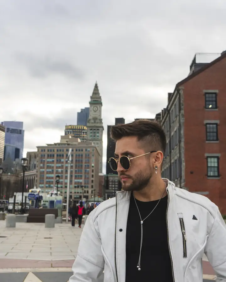Nicko Guerrero in front of a clock tower
