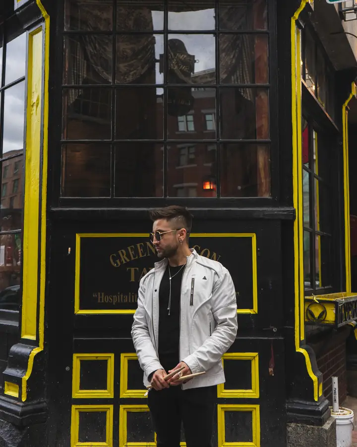 Nicko Guerrero before a yellow-trimmed doorway
